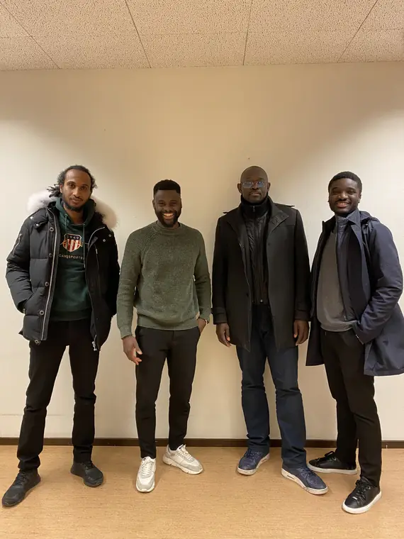 Four men side by side after a session